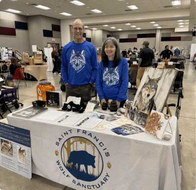 Volunteers at wolf sanctuary informational booth